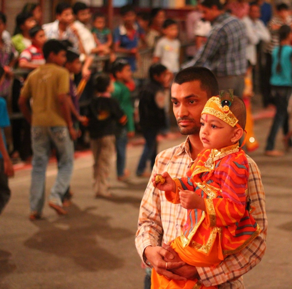 Child and father at festival in India