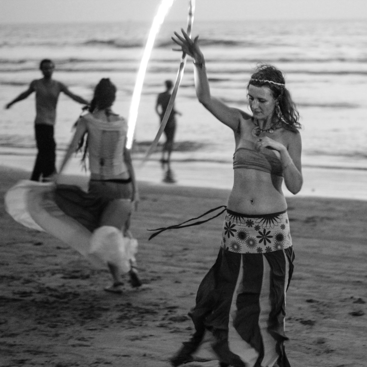 Hippie dancing on a beach in Goa