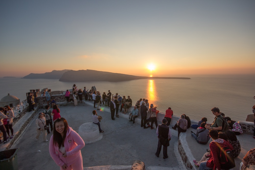 Santorini tourists watching the sunset. 