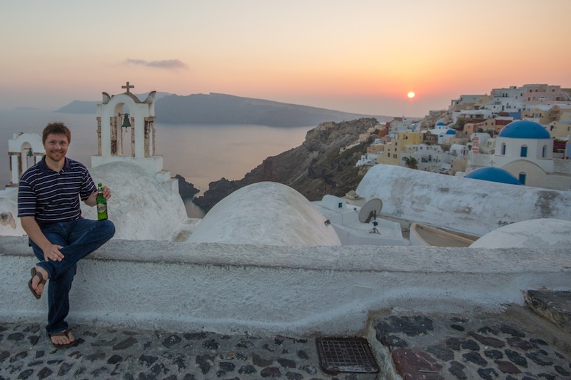Jeff Bell drinking a beer in Santorini