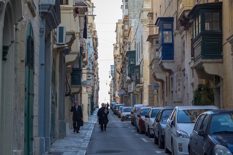 Priest and businessman in Valletta.