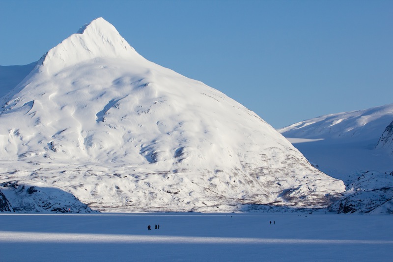 Hikers, Skiers and Pets on Portage Lake in the Winter.