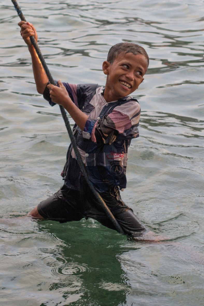 Boy swimming at Rinca