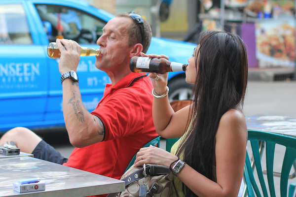 Asian lady drinking beer