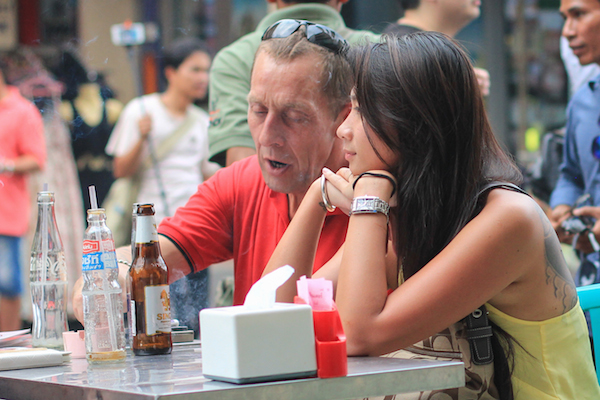 Old man, young lady in Asia