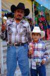 Mexican cowboy and son