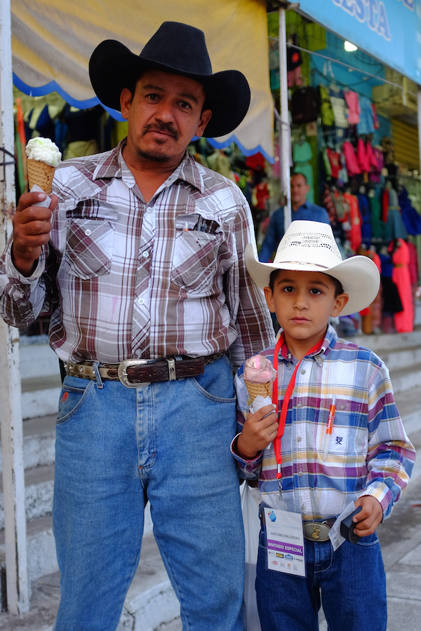 Mexican cowboy and son