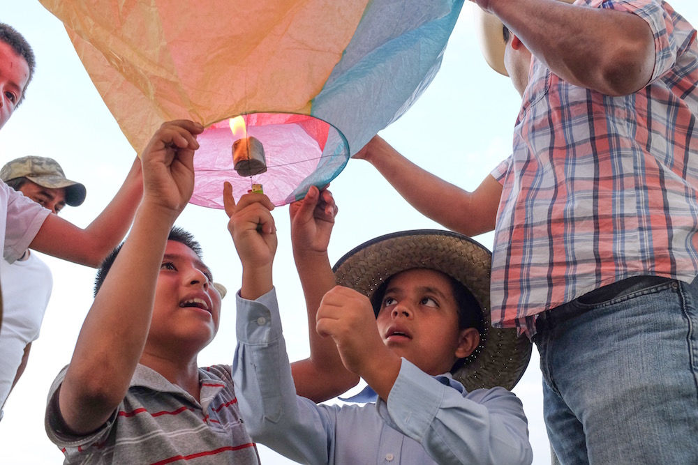 Boy lights a lantern, Zozocolco