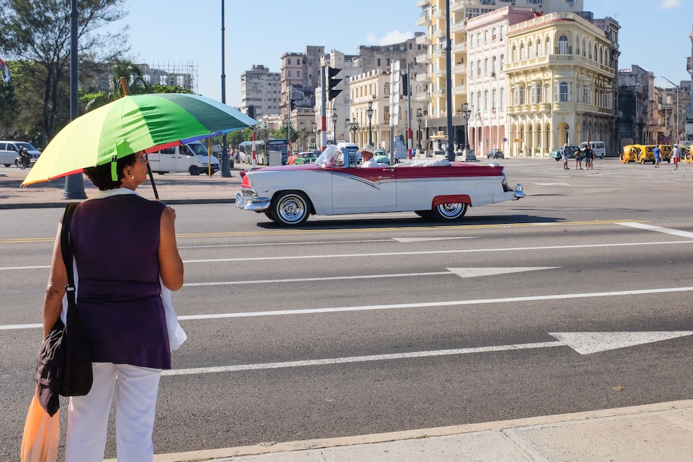 Havana classic car and lady with umbrella