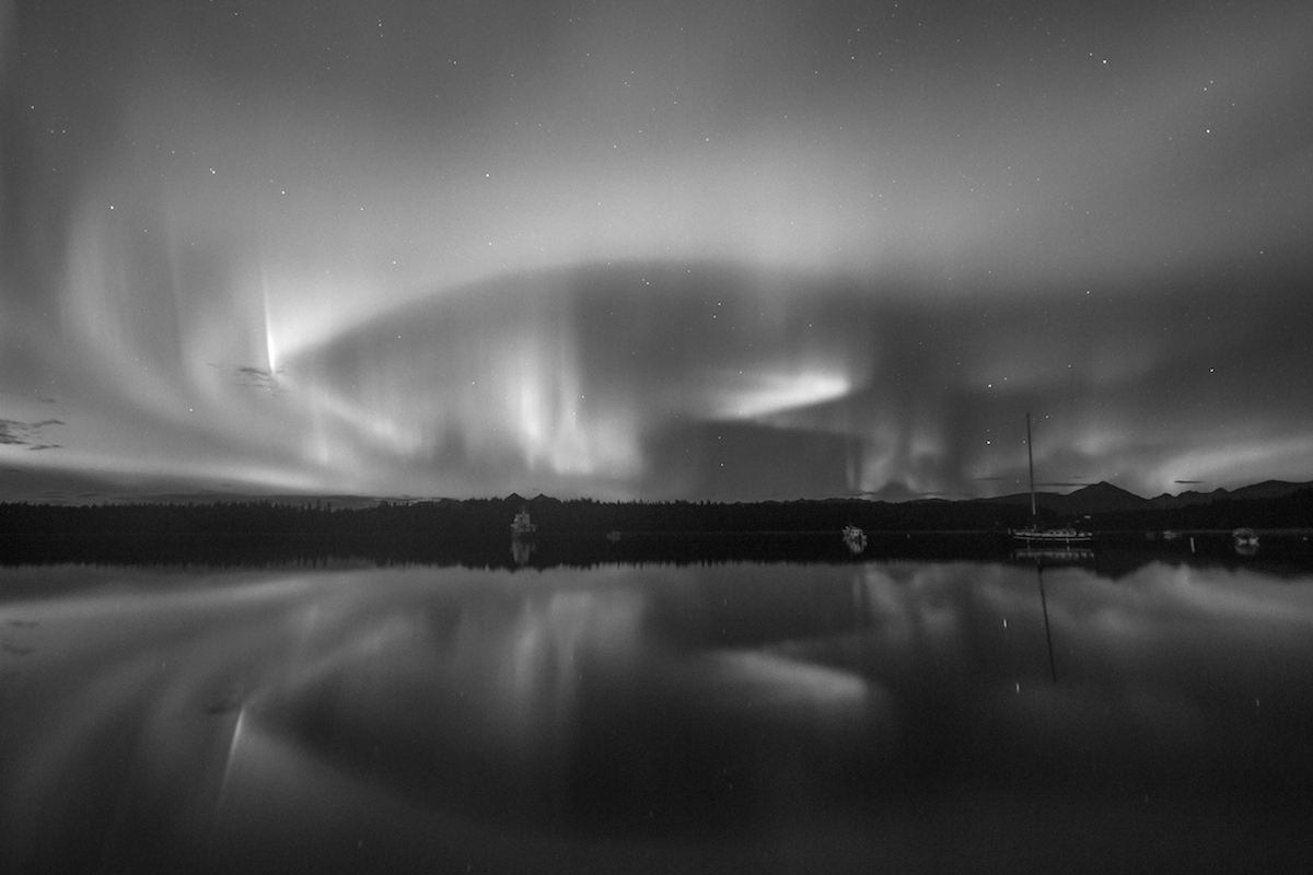 Northern Lights in black and white over Bartlett Cove. 