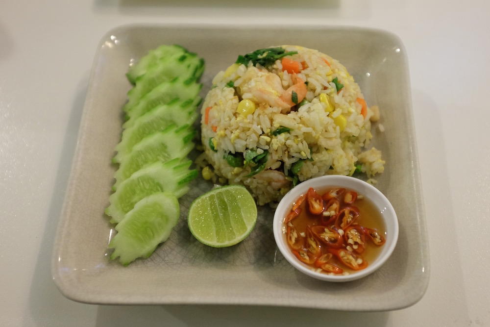 Prik Nam Blah, or chili fish sauce, is that evil looking condiment on the bottom right of the plate. If the dish isn't hot enough to burn a hole in your chest, adding this will do the trick. 