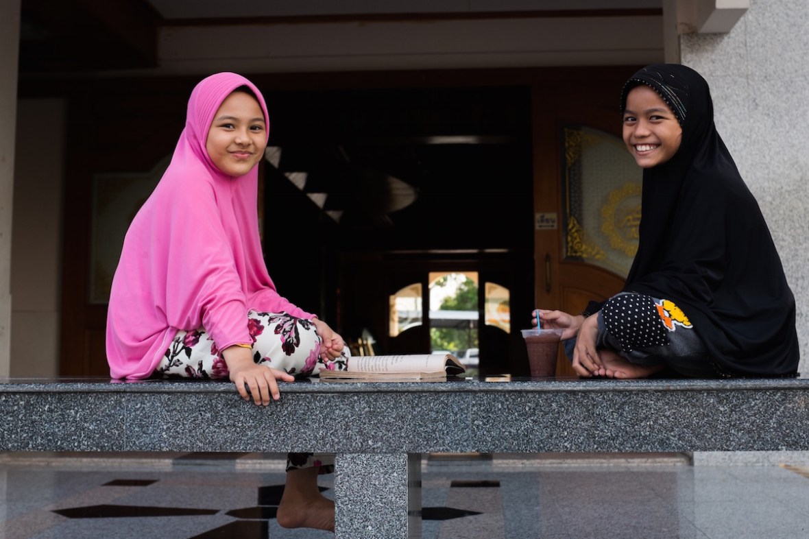 Two girls at a local mosque in Bangkok