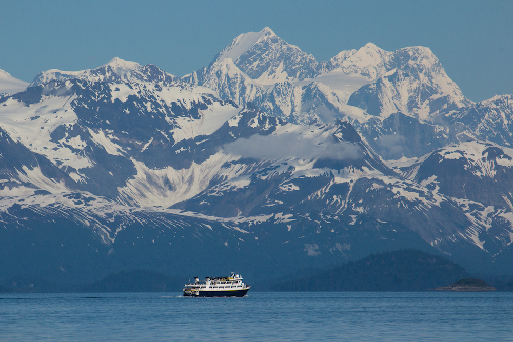 Boat in Glacier Bay in front of Mount Fairweather