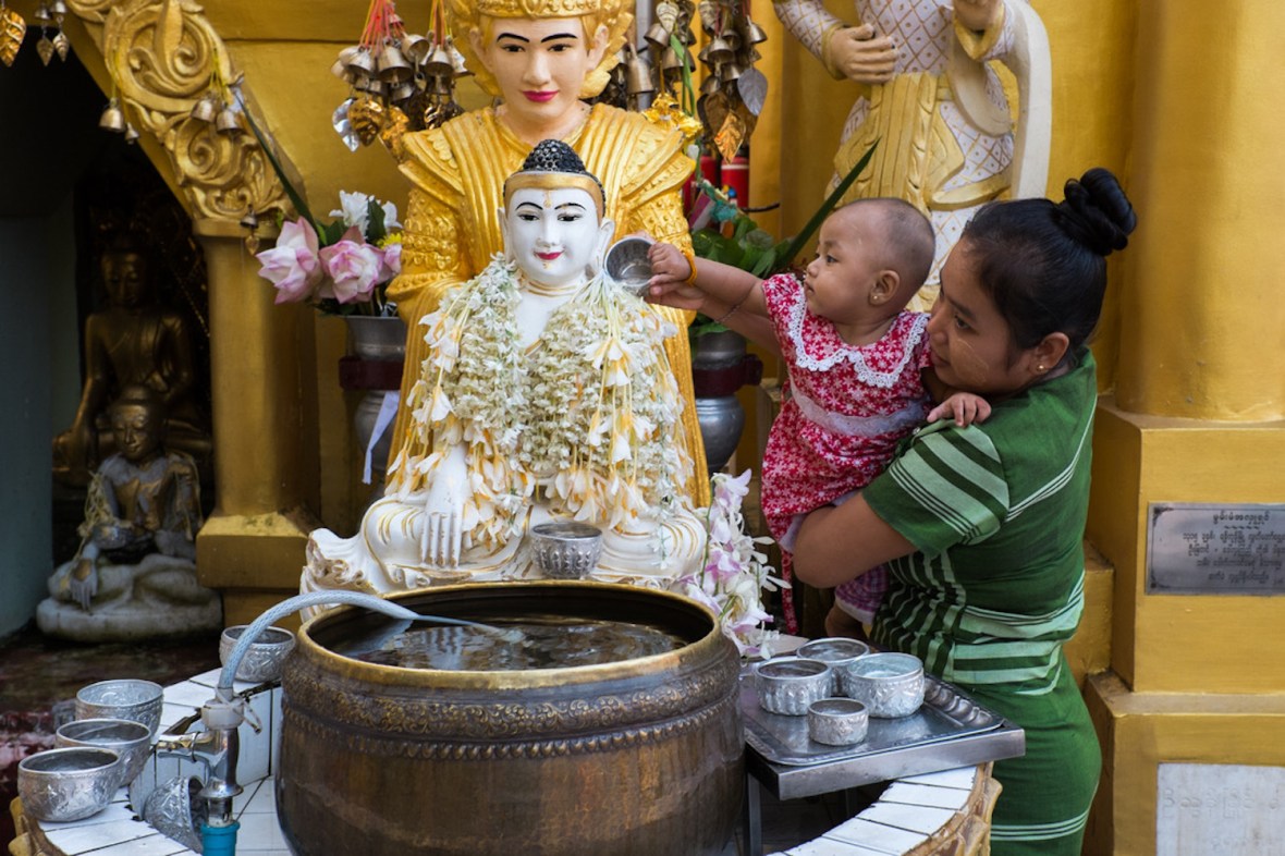Shwedagon street photography pouring water
